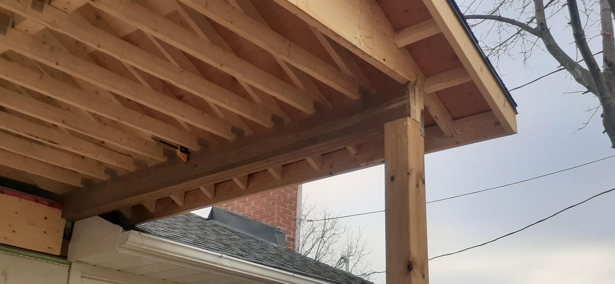 Covered porch roof framing