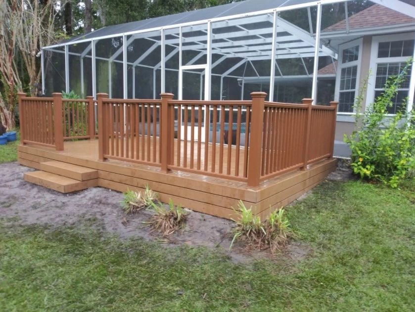 Deck alongside a pool enclosure