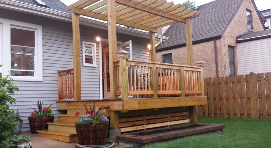 Backyard deck with an attached pergola