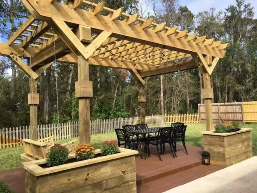 Freestanding wood pergola over a backyard patio, built by Working With Wood